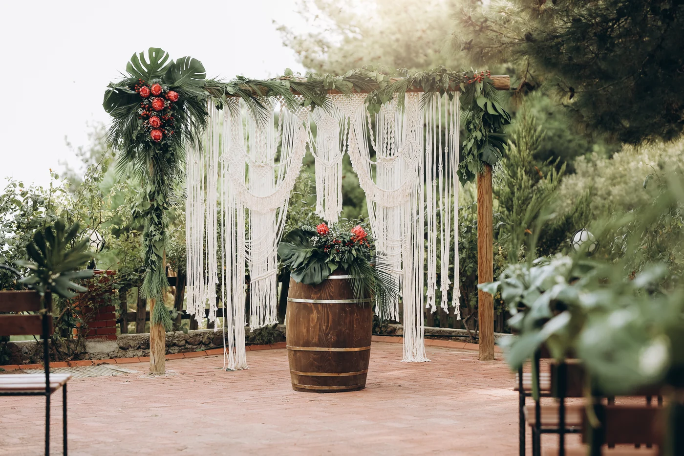 Outdoor wedding ceremony with a macramé arch